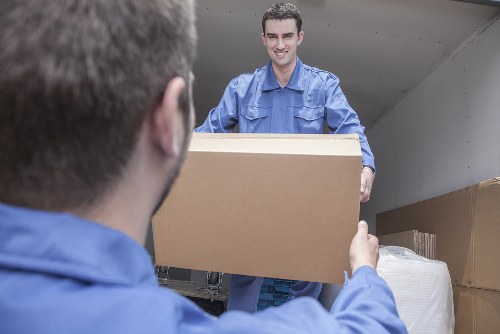 Furniture pick-up service removing a sofa in Streatham