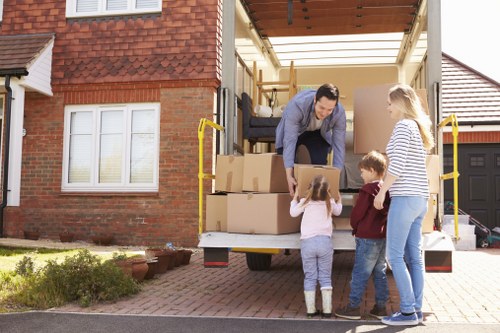 Moving team loading household items during a removals service