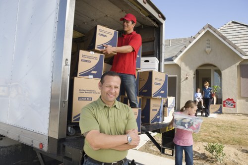 Removal van and packed boxes prepared for a relocation job
