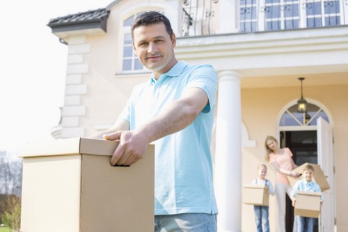 Trained removal staff handling items carefully in a property