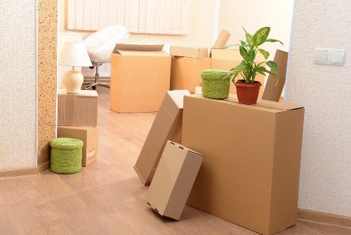 Professional movers carrying furniture during a student relocation in Streatham