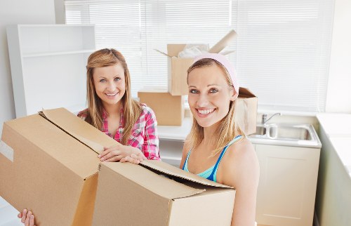 Commercial moving team handling office furniture in Streatham