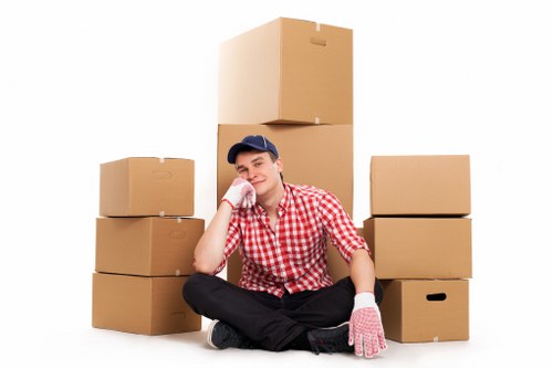 Professional movers carrying furniture during a Streatham home move